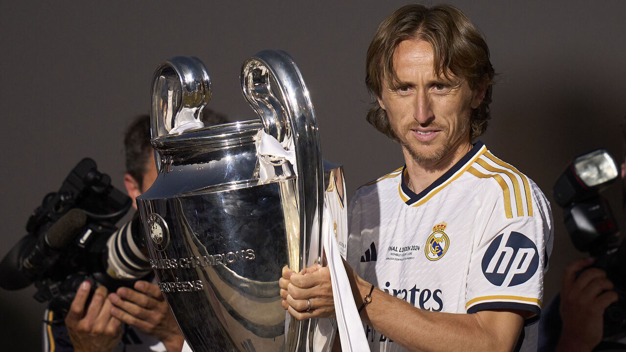 MADRID, SPAIN - JUNE 02: Luka Modric of Real Madrid celebrates with Trophy at Fuente de Cibeles during Real Madrid UEFA Champions League Trophy Parade on June 02, 2024 in Madrid, Spain.
