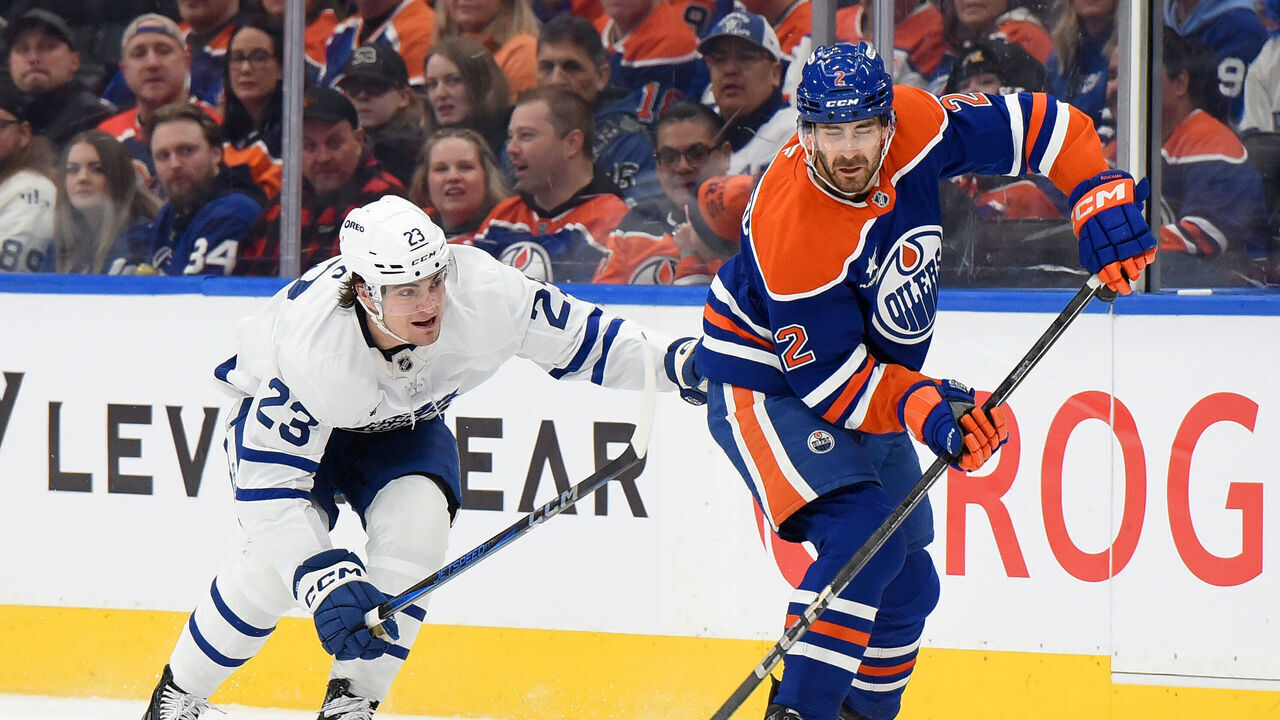EDMONTON, CANADA - FEBRUARY 1: Evan Bouchard #2 of the Edmonton Oilers skates against Matthew Knies #23 of the Toronto Maple Leafs during the first period of the game at Rogers Place on February 1, 2025 in Edmonton, Alberta, Canada.