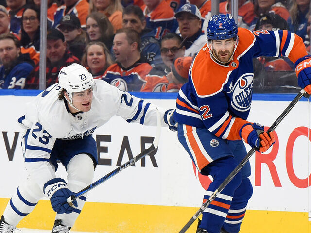 EDMONTON, CANADA - FEBRUARY 1: Evan Bouchard #2 of the Edmonton Oilers skates against Matthew Knies #23 of the Toronto Maple Leafs during the first period of the game at Rogers Place on February 1, 2025 in Edmonton, Alberta, Canada.