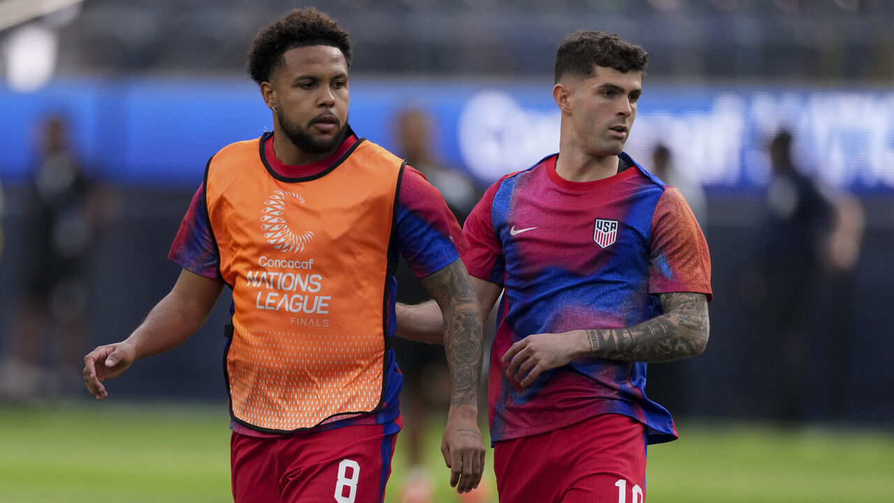 INGLEWOOD, CA - MARCH 20: Weston McKennie #8 and Christian Pulisic #10 of USA warm up before the CONCACAF Nations League semifinal match between United States and Panama at SoFi Stadium on March 20, 2025 in Inglewood, California.