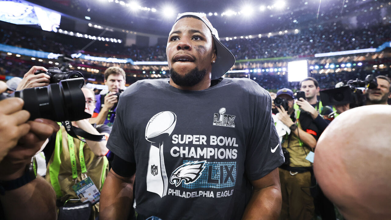 NEW ORLEANS, LOUISIANA - FEBRUARY 09: Saquon Barkley (26) of the Philadelphia Eagles celebrates on the field after Super Bowl LIX against the Kansas City Chiefs at Caesars Superdome on February 09, 2025, in New Orleans, Louisiana. The Eagles defeated the Chiefs 40-22.