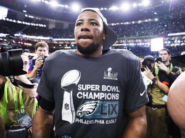NEW ORLEANS, LOUISIANA - FEBRUARY 09: Saquon Barkley (26) of the Philadelphia Eagles celebrates on the field after Super Bowl LIX against the Kansas City Chiefs at Caesars Superdome on February 09, 2025, in New Orleans, Louisiana. The Eagles defeated the Chiefs 40-22.