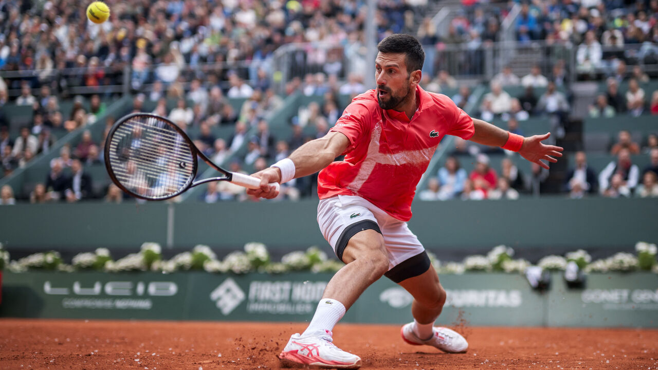 Serbia's Novak Djokovic returns a ball to Hungary's Marton Fucsovics during their match at the ATP 250 Geneva Open tennis tournament in Geneva on May 21, 2025.