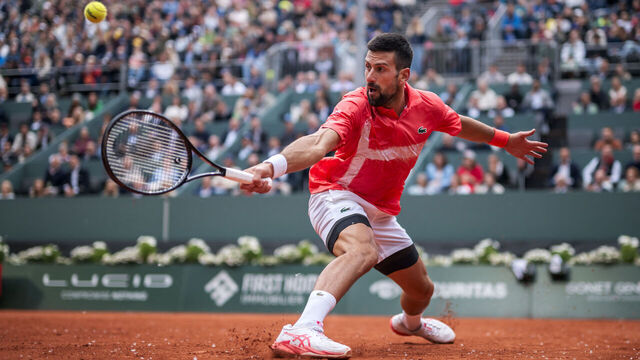 Serbia's Novak Djokovic returns a ball to Hungary's Marton Fucsovics during their match at the ATP 250 Geneva Open tennis tournament in Geneva on May 21, 2025.