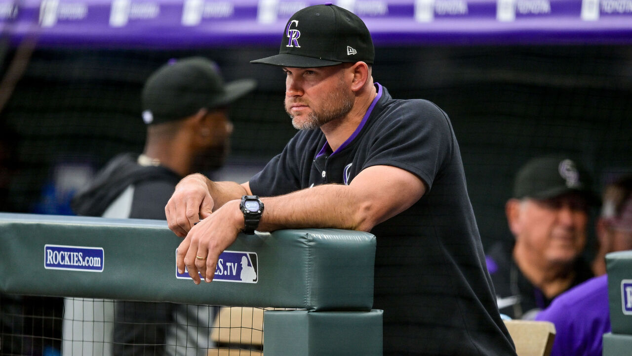 DENVER, CO - MAY 19: Colorado Rockies interim manager Warren Schaeffer (34) looks on from the dugout during a game between the Philadelphia Phillies and the Colorado Rockies at Coors Field on May 19, 2025 in Denver, Colorado.