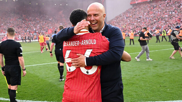 LIVERPOOL, ENGLAND - APRIL 27: (SUN OUT, SUN ON SUNDAY OUT) Arne Slot, Manger of Liverpool, embraces Trent Alexander-Arnold of Liverpool, as they celebrate the teams victory and confirmation of winning the Premier League title after the Premier League match between Liverpool FC and Tottenham Hotspur FC at Anfield on April 27, 2025 in Liverpool, England.