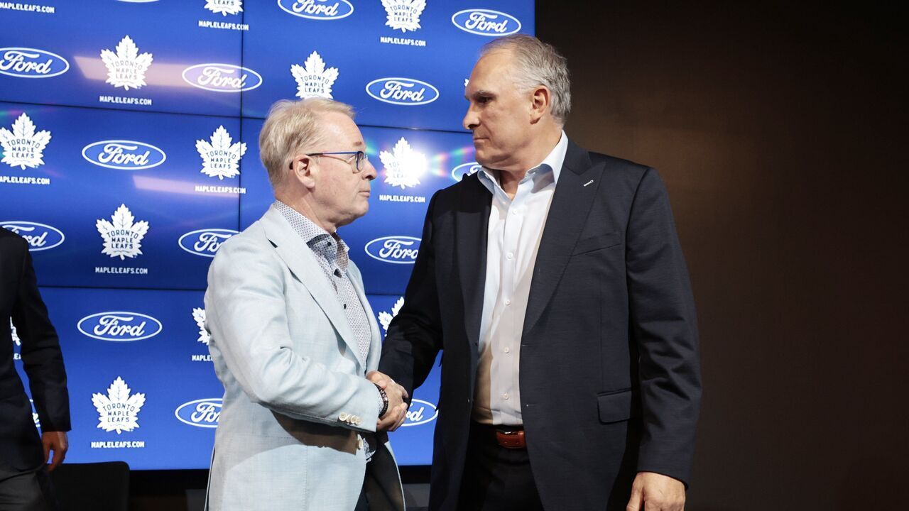 TORONTO.Keith Pelley, CEO (L) shakes the hand of Craig Berube, head coach,(R) New Toronto Maple Leafs head coach Craig Berube being introduced. (R.J.Johnston/Toronto Star) R.J. Johnston/Toronto Star (R.J. Johnston/Toronto Star via Getty Images)