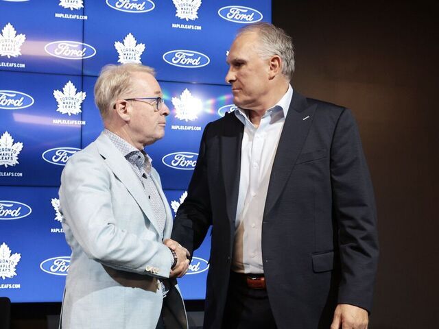 TORONTO.Keith Pelley, CEO (L) shakes the hand of Craig Berube, head coach,(R) New Toronto Maple Leafs head coach Craig Berube being introduced. (R.J.Johnston/Toronto Star) R.J. Johnston/Toronto Star (R.J. Johnston/Toronto Star via Getty Images)