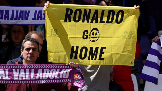 VALLADOLID, SPAIN - APRIL 20: A Real Valladolid CF fan holds up a sign in protest of the clubs president Ronaldo Nazário de Lima (not pictured), which reads "Ronaldo Go Home" prior to the LaLiga match between Real Valladolid CF and CA Osasuna at Jose Zorrilla on April 20, 2025 in Valladolid, Spain.