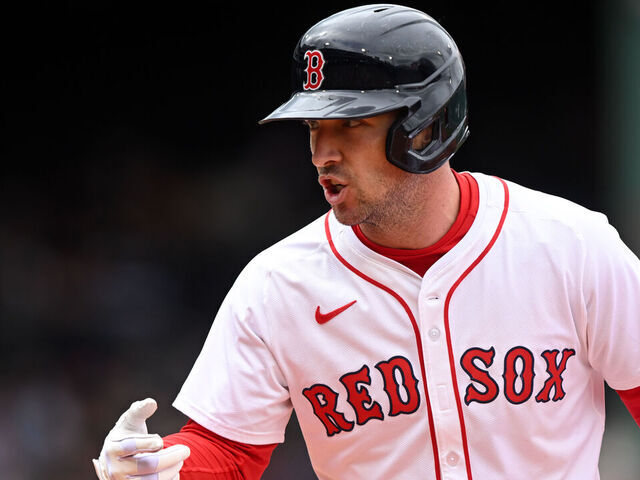 BOSTON, MASSACHUSETTS - MAY 23: Alex Bregman #2 of the Boston Red Sox calls to the dugout for a trainer after hitting a single against the Baltimore Orioles during the fifth inning at Fenway Park on May 23, 2025 in Boston, Massachusetts.