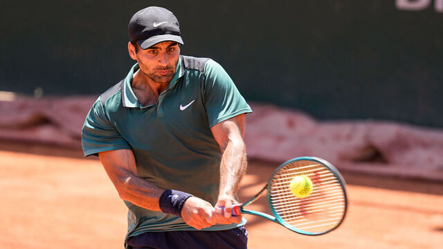 PARIS, FRANCE - MAY 23: Benjamin Hassan of Lebanon plays a backhand in the Men's Singles Qualifying Round match against James Kent Trotter of Japan during the Day 5 of the opening week at Roland Garros on May 23, 2025 in Paris, France.