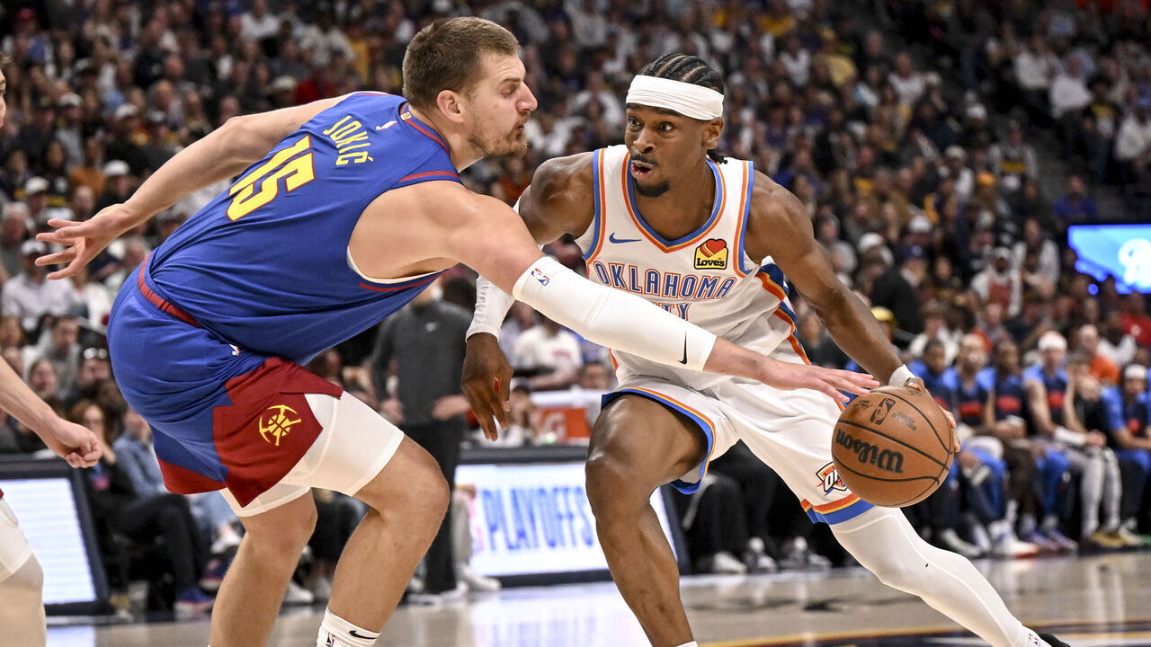 DENVER, CO - MAY 9: Nikola Jokic (15) of the Denver Nuggets pokes the ball away from Shai Gilgeous-Alexander (2) of the Oklahoma City Thunder during the first quarter at Ball Arena in Denver, Colorado on Friday, May 9, 2025.