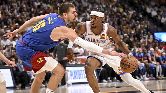 DENVER, CO - MAY 9: Nikola Jokic (15) of the Denver Nuggets pokes the ball away from Shai Gilgeous-Alexander (2) of the Oklahoma City Thunder during the first quarter at Ball Arena in Denver, Colorado on Friday, May 9, 2025.