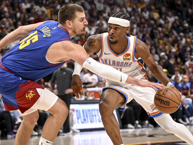 DENVER, CO - MAY 9: Nikola Jokic (15) of the Denver Nuggets pokes the ball away from Shai Gilgeous-Alexander (2) of the Oklahoma City Thunder during the first quarter at Ball Arena in Denver, Colorado on Friday, May 9, 2025.