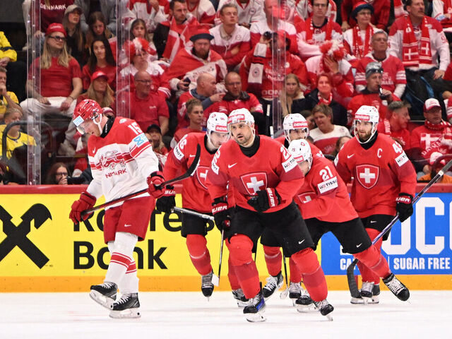 Switzerland's forward #22 Nino Niederreiter celebrates his 1-0 during the IIHF Men's Ice Hockey World Championship semi-final match between Switzerland and Denmark in Stockholm, on May 24, 2025.