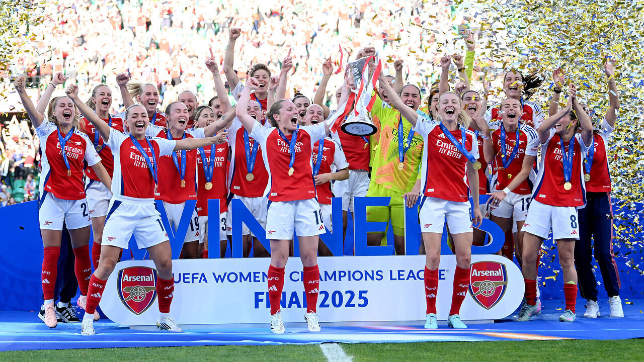 LISBON, PORTUGAL - MAY 24: Kim Little and Leah Williamson of Arsenal lift the UEFA Women's Champions League trophy after their team's victory in the UEFA Women's Champions League final match between Arsenal WFC and FC Barcelona at Estadio Jose Alvalade on May 24, 2025 in Lisbon, Portugal.