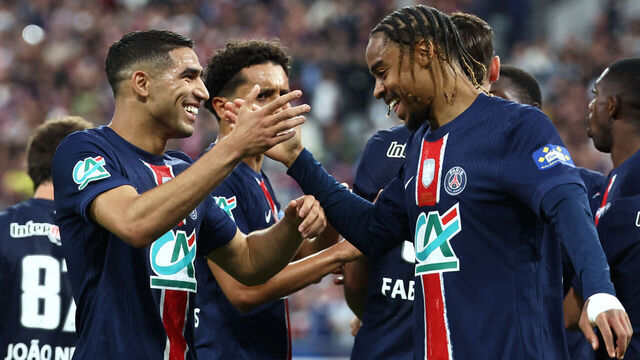 Paris Saint-Germain's Moroccan defender #02 Achraf Hakimi (L) celebrates with Paris Saint-Germain's French forward #29 Bradley Barcola (R) after scoring his team's third goal during the French Cup final football match between Paris Saint-Germain (PSG) and Stade de Reims at the Stade de France in Saint-Denis, north of Paris, on May 24, 2025.