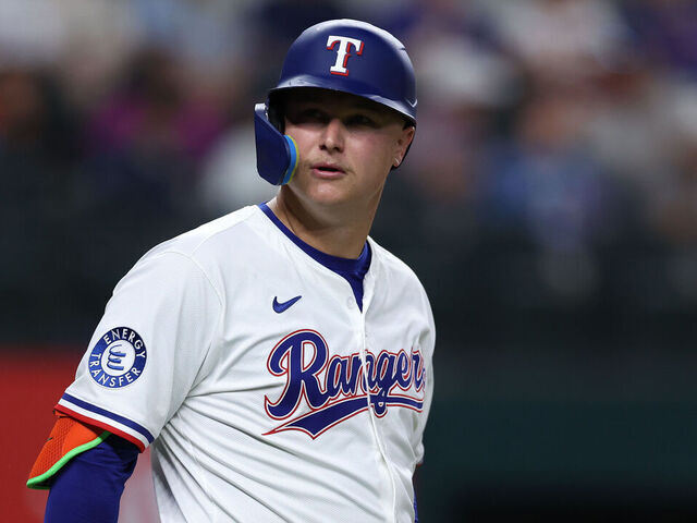 ARLINGTON, TEXAS - MAY 14: Joc Pederson #4 of the Texas Rangers look on during the fourth inning against the Colorado Rockies at Globe Life Field on May 14, 2025 in Arlington, Texas.