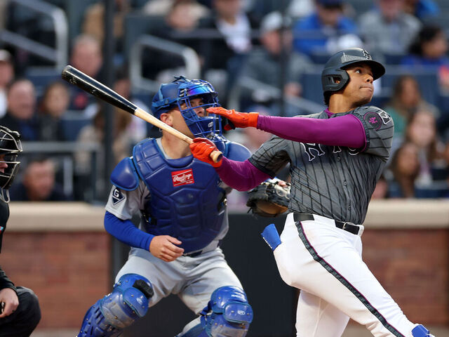 NEW YORK, NEW YORK - MAY 24: Juan Soto #22 of the New York Mets flies out to center as Dalton Rushing #68 of the Los Angeles Dodgers defends in the first inning at Citi Field on May 24, 2025 in the Flushing neighborhood of the Queens borough of New York City.