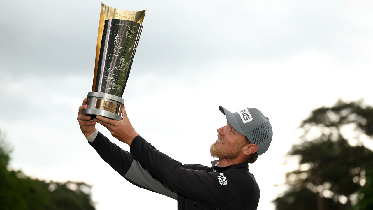 ANTWERP, BELGIUM - MAY 25: Kristoffer Reitan of Norway lifts the Soudal Open trophy following victory in the second playoff hole on day four of the Soudal Open 2025 at Rinkven International GC on May 25, 2025 in Antwerp, Belgium.