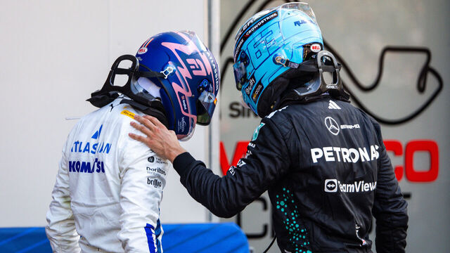 MONTE-CARLO, MONACO - MAY 25: Alexander Albon of Thailand and Williams speaks with George Russell of Great Britain and Mercedes whilst getting weighed in Parc ferme during the F1 Grand Prix of Monaco at Circuit de Monaco on May 25, 2025 in Monte-Carlo, Monaco.