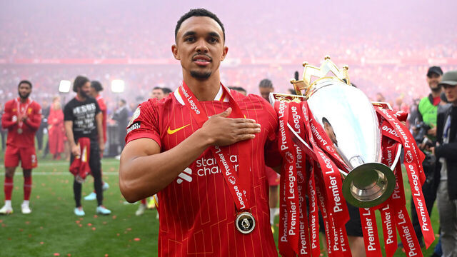 LIVERPOOL, ENGLAND - MAY 25: Trent Alexander-Arnold of Liverpool, celebrates with Premier League trophy after his final appearance for Liverpool as Liverpool are crowned the Champions of the Premier League for the 2024/25 Season, following the Premier League match between Liverpool FC and Crystal Palace FC at Anfield on May 25, 2025 in Liverpool, England.