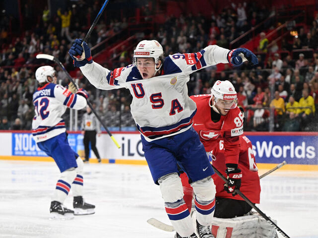 US forward #92 Logan Cooley (C) celebrates after his team mates US forward #72 Tage Thompson (L) scored the goal to win gold during the overtime of the IIHF Men's Ice Hockey World Championship final match between Switzerland and USA in Stockholm, on May 25, 2025.