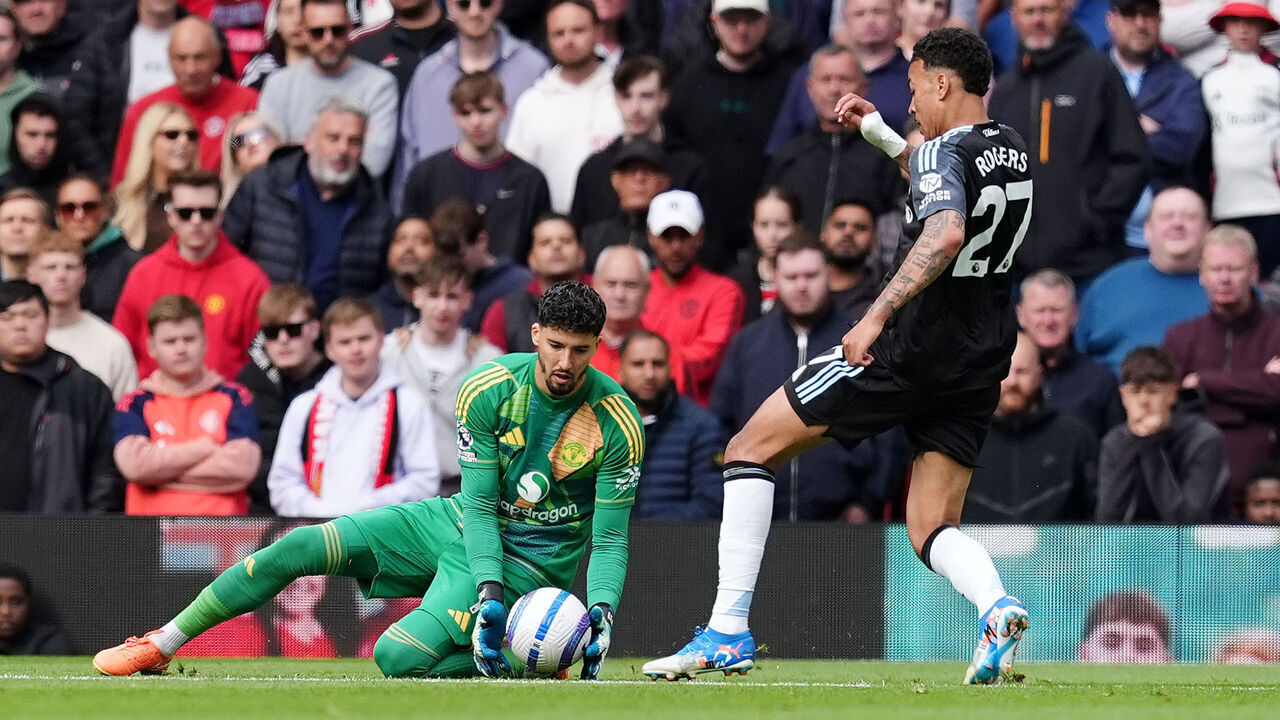 Aston Villa's Morgan Rogers (right) kicks the ball away from Manchester United goalkeeper Altay Bayindir before scoring only for the goal to be disallowed by referee Thomas Bramall during the Premier League match at Old Trafford, Manchester. Picture date: Sunday May 25, 2025.