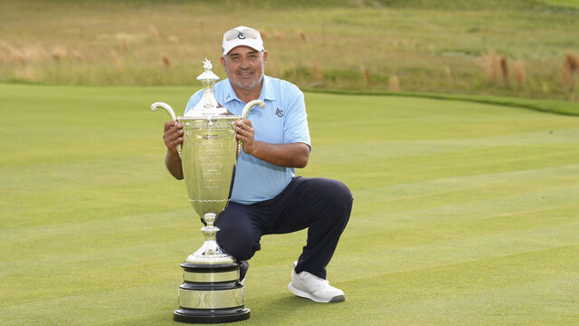 lang="x-default" BETHESDA, MD - MAY 25: Angel Cabrera poses with the Alfred S. Bourne Trophy after winning the Senior PGA Championship at Congressional Country Club on Sunday, May 25, 2025 in Bethesda, Maryland.
