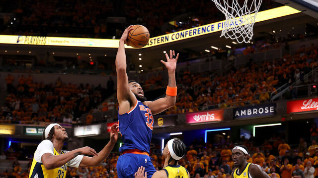 INDIANAPOLIS, INDIANA - MAY 25: Karl-Anthony Towns #32 of the New York Knicks drives to the basket against Andrew Nembhard #2 of the Indiana Pacers during the fourth quarter in Game Three of the Eastern Conference Finals of the 2025 NBA Playoffs at Gainbridge Fieldhouse on May 25, 2025 in Indianapolis, Indiana.
