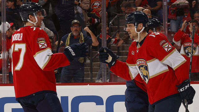 SUNRISE, FLORIDA - DECEMBER 2: Sam Reinhart #13 celebrates his goal with teammate Niko Mikkola #77 of the Florida Panthers during the first period against the New York Islanders at the Amerant Bank Arena on December 2, 2023 in Sunrise, Florida.