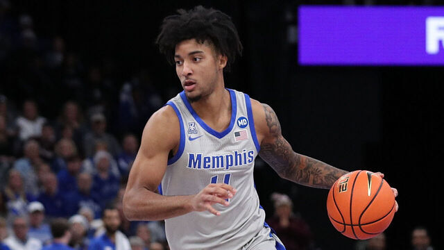 MEMPHIS, TENNESSEE - DECEMBER 21: PJ Haggerty #4 of the Memphis Tigers handles the ball during the game ppi State Bulldogs at FedExForum on December 21, 2024 in Memphis, Tennessee.
