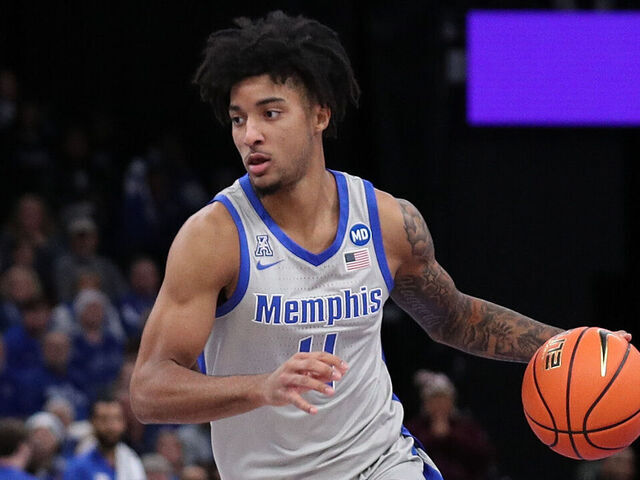 MEMPHIS, TENNESSEE - DECEMBER 21: PJ Haggerty #4 of the Memphis Tigers handles the ball during the game ppi State Bulldogs at FedExForum on December 21, 2024 in Memphis, Tennessee.