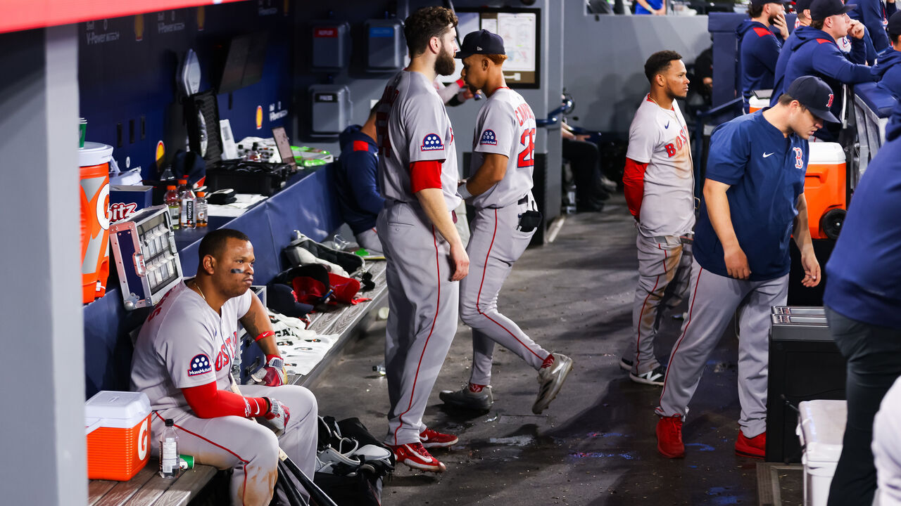 TORONTO, CANADA - APRIL 30: Rafael Devers #11 of the Boston Red Sox sits in the dugout during their MLB game against the Toronto Blue Jays at Rogers Centre on April 30, 2025 in Toronto, Ontario, Canada.