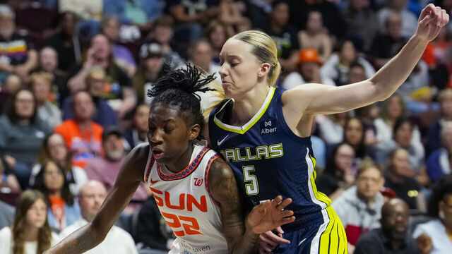 UNCASVILLE, CONNECTICUT - MAY 27: Saniya Rivers #22 of the Connecticut Sun posts up against Paige Bueckers #5 of the Dallas Wings during the first half at Mohegan Sun Arena on May 27, 2025 in Uncasville, Connecticut.