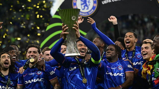 Chelsea's players celebrate with the trophy after the UEFA Conference League final football match between Real Betis and Chelsea FC in Wroclaw on May 28, 2025.