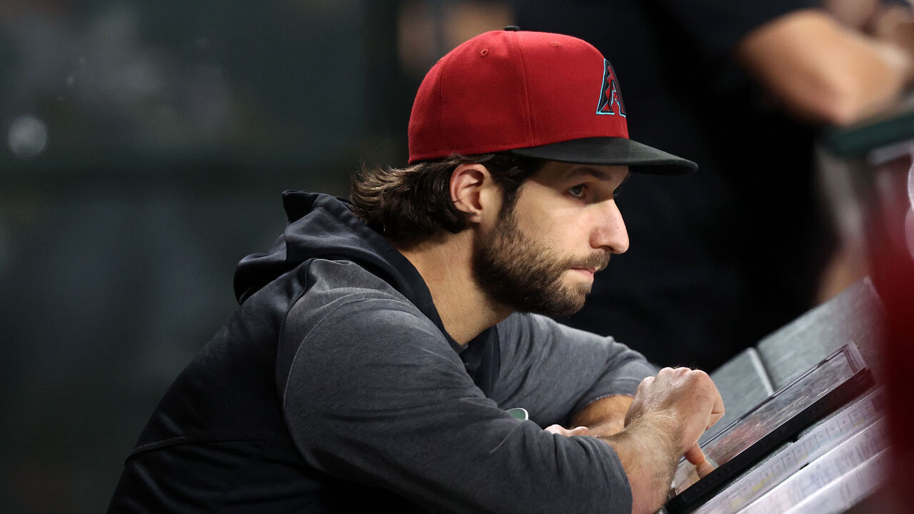PHOENIX, ARIZONA - APRIL 24: Zac Gallen #23 of the Arizona Diamondbacks watches the action from the dugout during the game against the Tampa Bay Rays at Chase Field on April 24, 2025 in Phoenix, Arizona. The Rays defeated the Diamondbacks 7-4 in ten innings.