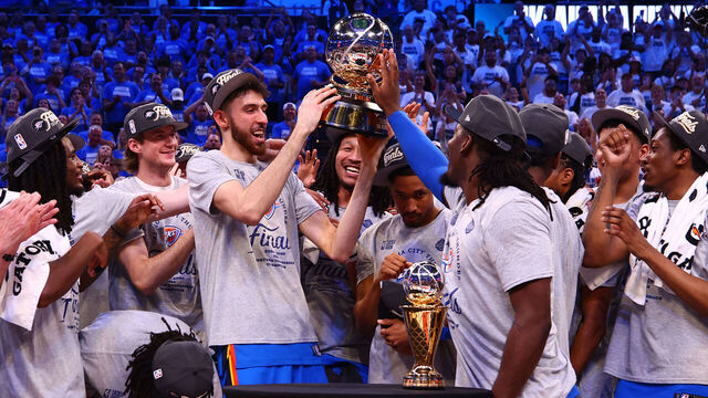 OKLAHOMA CITY, OK - MAY 28: The Oklahoma City Thunder pose for a photo with the Oscar Robertson Western Conference Champion trophy during Game Five of the Western Conference Finals on May 28, 2025 at Paycom Center in Oklahoma City, Oklahoma. Mandatory Copyright Notice: Copyright 2025 NBAE