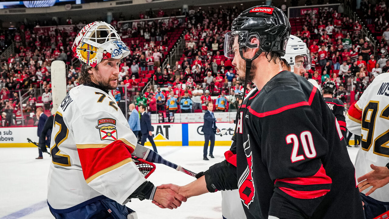 RALEIGH, NC - MAY 28: Goaltender Sergei Bobrovsky #72 of the Florida Panthers shakes hands with Sebastian Aho #20 of the Carolina Hurricanes after the Florida Panthers defeat the Carolina Hurricanes in the Eastern Conference Final of the 2025 Stanley Cup Playoffs at Lenovo Center on May 28, 2025 in Raleigh, North Carolina.