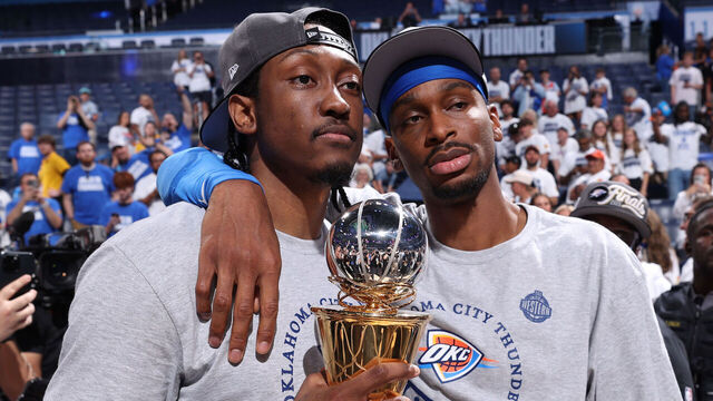 OKLAHOMA CITY, OK - MAY 28: Jalen Williams #8 and Shai Gilgeous-Alexander #2 of the Oklahoma City Thunder pose for a photo with the Earvin "Magic" Johnson Trophy for the NBA Western Conference Finals Most Valuable Player Award after the game against the Minnesota Timberwolves during Game 5 of the 2025 NBA Western Conference Finals on May 28, 2025 at Paycom Center in Oklahoma City, Oklahoma. Mandatory Copyright Notice: Copyright 2025 NBAE
