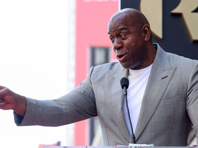Former US basketball player Earvin "Magic" Johnson speaks during Billie Jean King's Hollywood Walk of Fame Star Ceremony in front of the W hotel, in Los Angeles, California, on April 7, 2025.
