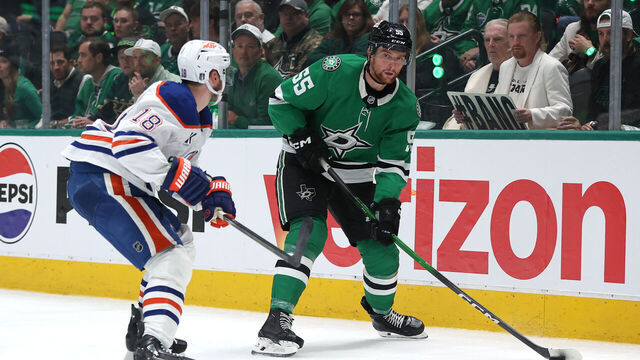 DALLAS, TEXAS - MAY 21: Thomas Harley #55 of the Dallas Stars is defended by Zach Hyman #18 of the Edmonton Oilers during the second period in Game One of the Western Conference Final of the 2025 Stanley Cup Playoffs at American Airlines Center on May 21, 2025 in Dallas, Texas.