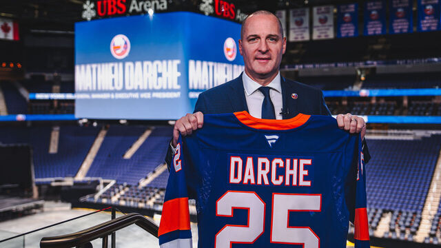 ELMONT, NEW YORK - MAY 29: Mathieu Darche poses for a photo holding a jersey after being named the 7th General Manager in New York Islanders history at UBS Arena, on May 29, 2025 in Elmont, New York.