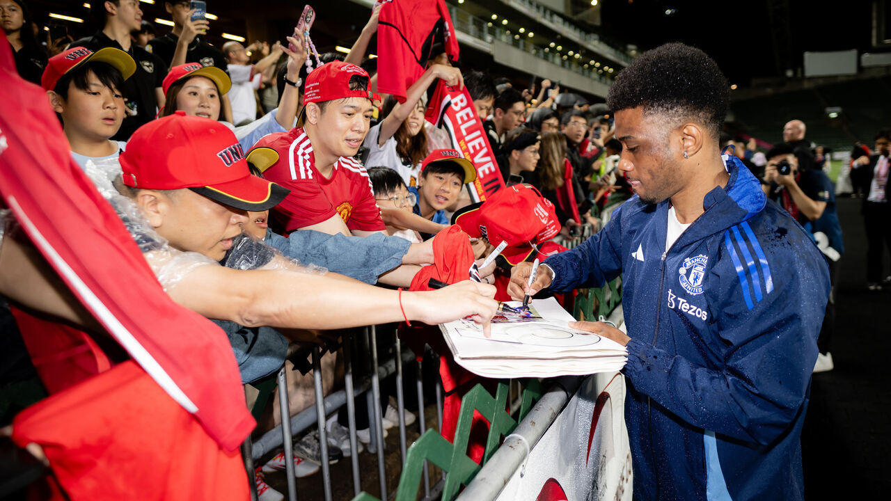 HONG KONG, CHINA - MAY 29: Amad Diallo of Manchester United signs autographs during the Manchester United Training session on May 29, 2025 in Hong Kong, China.