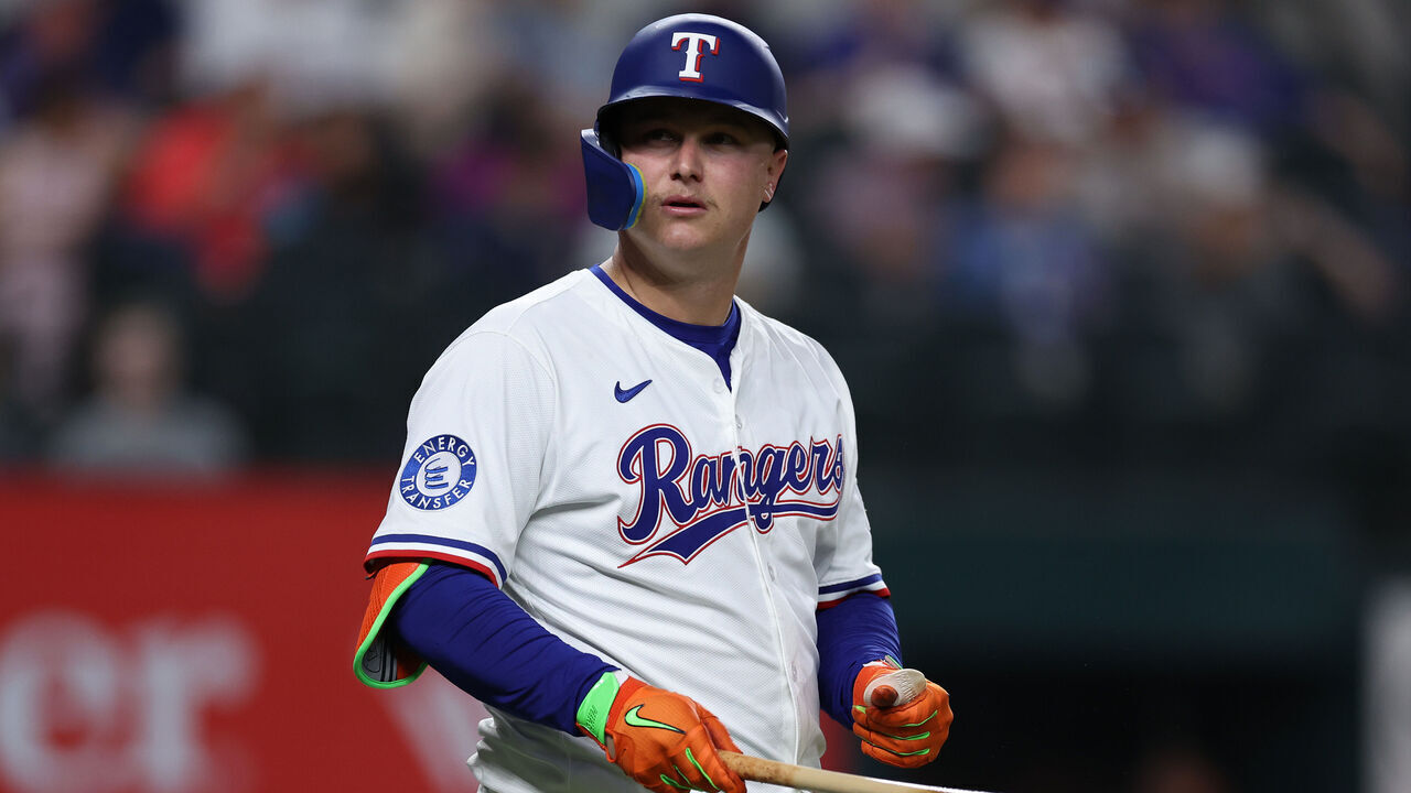 ARLINGTON, TEXAS - MAY 14: Joc Pederson #4 of the Texas Rangers look on during the fourth inning against the Colorado Rockies at Globe Life Field on May 14, 2025 in Arlington, Texas.