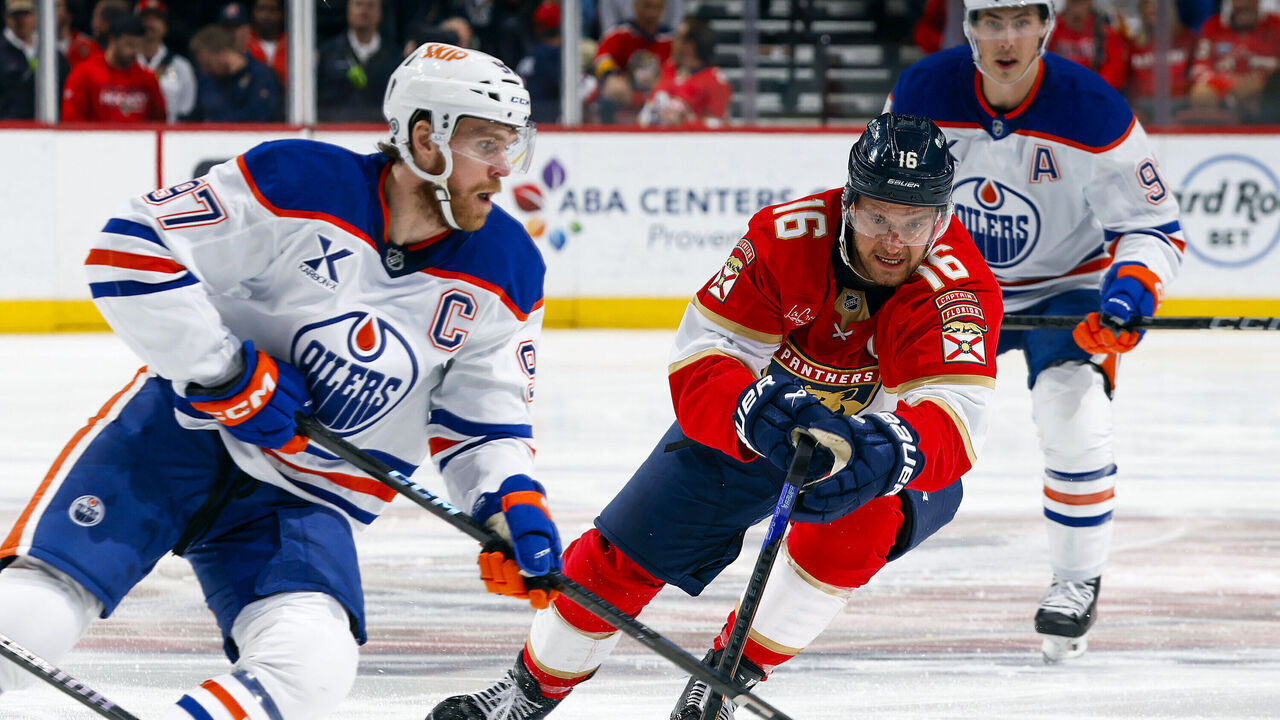 SUNRISE, FL - FEBRUARY 27: Aleksander Barkov #16 of the Florida Panthers defends against Connor McDavid #97 of the Edmonton Oilers during first period action at the Amerant Bank Arena on February 27, 2025 in Sunrise, Florida.