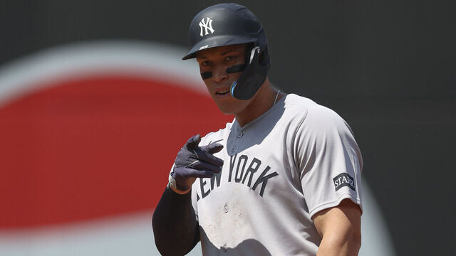 CLEVELAND, OHIO - APRIL 23: Aaron Judge #99 of the New York Yankees celebrates after an RBI single hit by Paul Goldschmidt #48 in the second inning during a game against the Cleveland Guardians at Progressive Field on April 23, 2025 in Cleveland, Ohio.