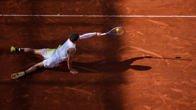 PARIS, FRANCE - MAY 30: Ben Shelton of the United States plays a backhand in the Men's Singles Third Round match against Matteo Gigante of Italy on Day Six of the 2025 French Open at Roland Garros on May 30, 2025 in Paris, France.