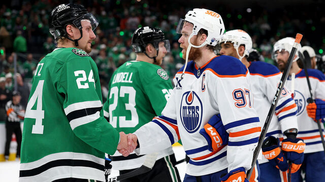 DALLAS, TEXAS - MAY 29: Roope Hintz #24 of the Dallas Stars and Connor McDavid #97 of the Edmonton Oilers shake hands after Game Five of the Western Conference Final of the 2025 Stanley Cup Playoffs at American Airlines Center on May 29, 2025 in Dallas, Texas.