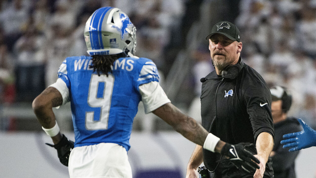 MINNEAPOLIS, MINNESOTA - DECEMBER 24: Head coach Dan Campbell of the Detroit Lions celebrates with Jameson Williams #9 after a play in the fourth quarter of the game against the Minnesota Vikings at U.S. Bank Stadium on December 24, 2023 in Minneapolis, Minnesota.